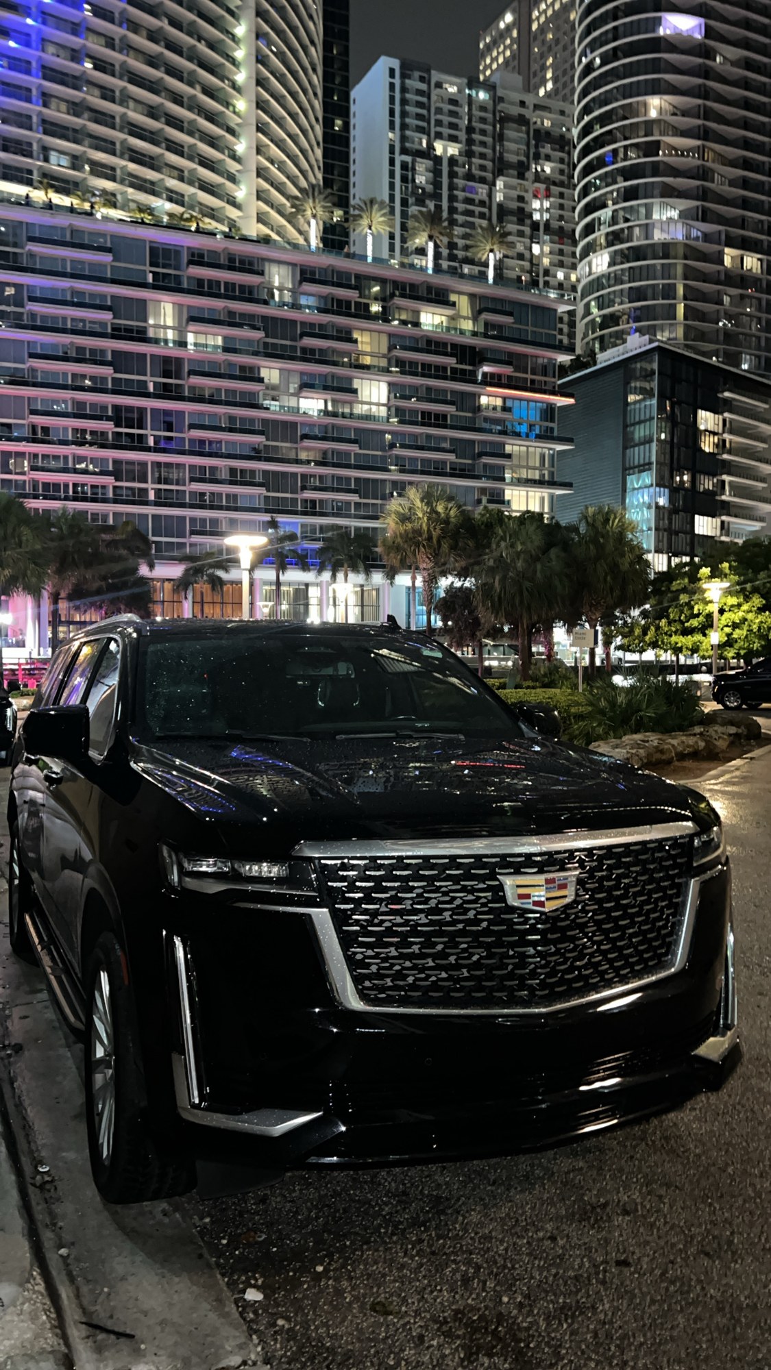 Black Cadillac Escalade in Miami at night